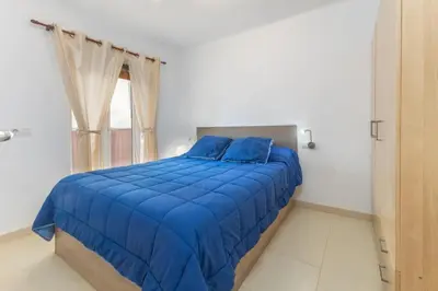 Cama o camas de una habitación en APARTAMENTO A 17 M. DE LA PLAYA
