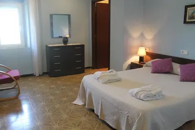 Cama o camas de una habitación en Hostal Can Bassalis