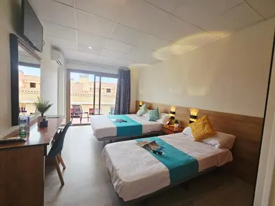 Cama o camas de una habitación en Hotel Mar i Sol
