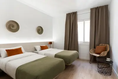 Cama o camas de una habitación en Apartamentos Venecia