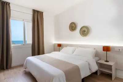 Cama o camas de una habitación en Apartamentos Venecia
