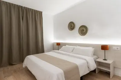 Cama o camas de una habitación en Apartamentos Venecia