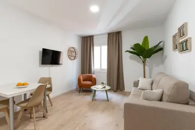Una televisión o centro de entretenimiento en Apartamentos Venecia