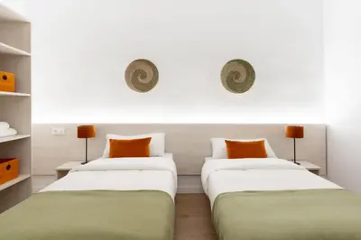 Cama o camas de una habitación en Apartamentos Venecia