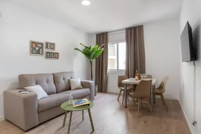 Una televisión o centro de entretenimiento en Apartamentos Venecia