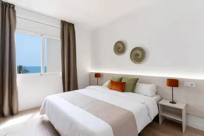Cama o camas de una habitación en Apartamentos Venecia