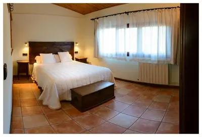 Cama o camas de una habitación en Apartamentos Rurales Els Masos d'en Coll