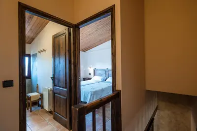 Cama o camas de una habitación en Apartamentos Rurales Els Masos d'en Coll