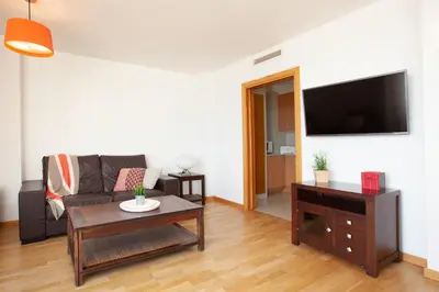 Una televisión o centro de entretenimiento en Lets Holidays AMAZING FRONT SEA VIEWS APARTMENT