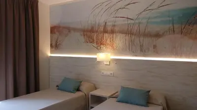 Cama o camas de una habitación en Aparthotel Las Mariposas