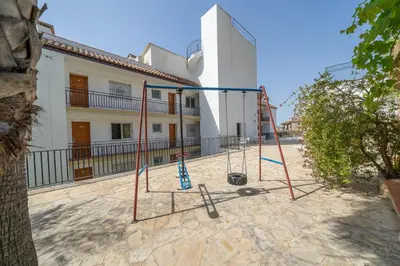 Zona de juegos infantil en Apartamentos Costamar