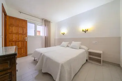 Cama o camas de una habitación en Apartamentos Costamar