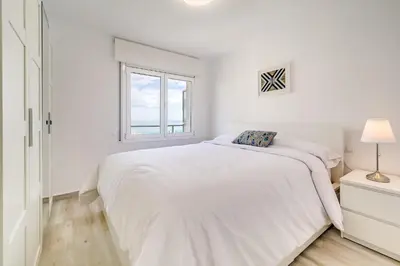 Cama o camas de una habitación en Hauzify I Apartament Rosa dels Vents