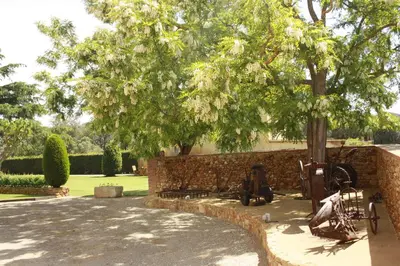 Jardín al aire libre en Masía Rural Can Poch