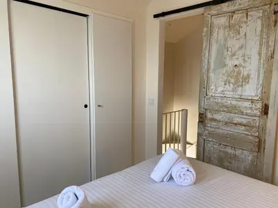 Cama o camas de una habitación en Casa Concha Apartamentos en primera linea de mar