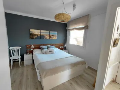 Cama o camas de una habitación en Apartamento en casa de campo cerca de la playa