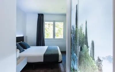 Cama o camas de una habitación en Hostal Ribas