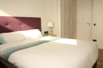 Cama o camas de una habitación en Seafront Apartment in Palamós
