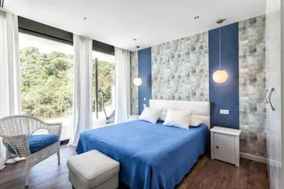 Cama o camas de una habitación en Lujo con piscina climatizada,jacuzzi,playa privada