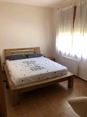 Cama o camas de una habitación en Casa Bellavista con piscina en Caldes Costa Brava