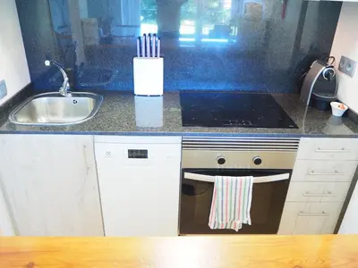 Una cocina o zona de cocina en Espectacular apartamento en el corazón de Calella!