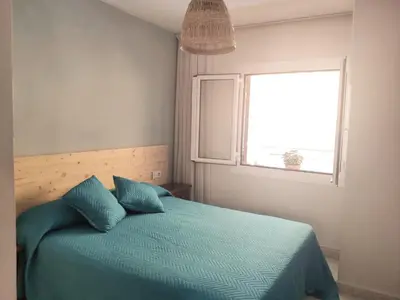 Cama o camas de una habitación en Apartamento a 150 metros de la playa en la Fosca