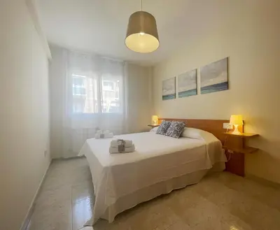 Cama o camas de una habitación en HomeHolidaysRentals Salvador