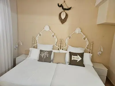 Cama o camas de una habitación en La Roqueta Hotel