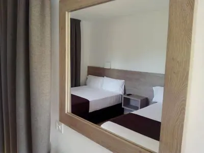 Cama o camas de una habitación en Hotel Hipica Park
