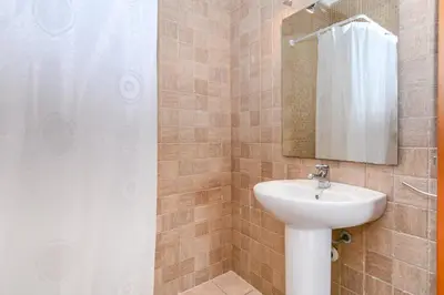 Un baño de Casa Cerca De La Playa