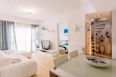 Una televisión o centro de entretenimiento en Duplex 3 habitaciones