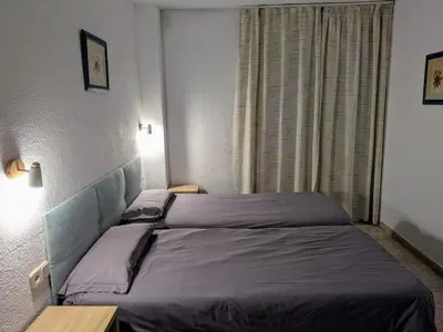Cama o camas de una habitación en Apartamentos Mitus