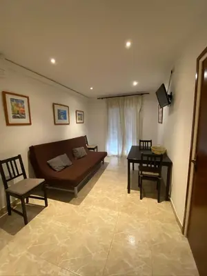 Una televisión o centro de entretenimiento en Apartamentos Mitus