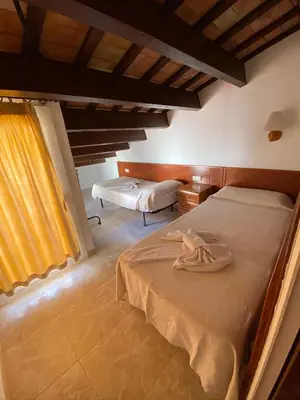 Cama o camas de una habitación en Apartamentos Mitus
