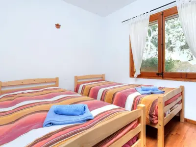 Cama o camas de una habitación en Holiday Home La Teulada by Interhome