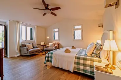 Cama o camas de una habitación en El Portió, tu casa de ensueño junto a la playa.
