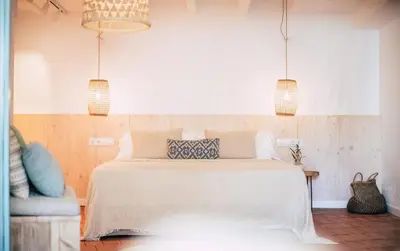Cama o camas de una habitación en Hostal Ses Negres