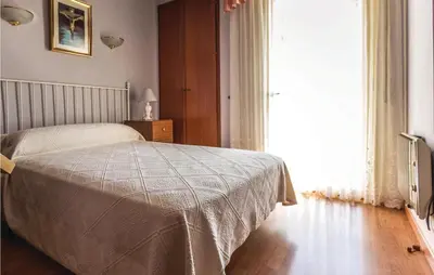 Cama o camas de una habitación en Nice Apartment In Blanes With Kitchen
