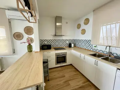 Una cocina o zona de cocina en LA CASA BLUE , Mediterranean Boutique-Villa in Santa Cristina Beach