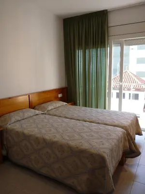 Cama o camas de una habitación en Apartaments Tropic
