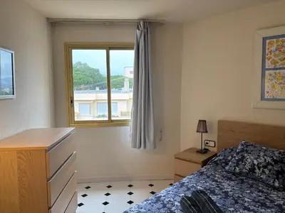 Cama o camas de una habitación en Precioso apartamento en S'Agaró con fantásticas vistas al mar