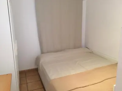 Cama o camas de una habitación en Estudio cerca del mar con terraza