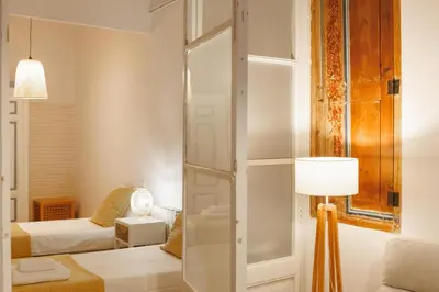 Cama o camas de una habitación en Bravissimo Plaça del Vi, Authentic Historic Apartment