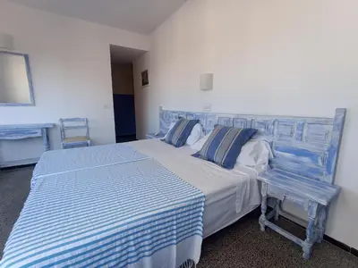 Cama o camas de una habitación en Hostal Santa Ana