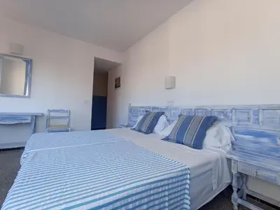 Cama o camas de una habitación en Hostal Santa Ana