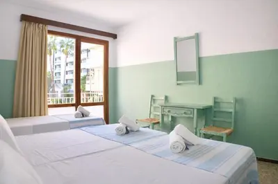 Cama o camas de una habitación en Hostal Santa Ana