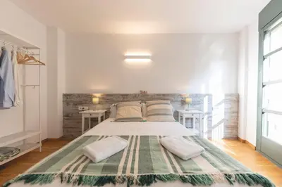 Cama o camas de una habitación en Bravissimo Sant Pau, cozy apartment in the centre