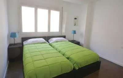 Cama o camas de una habitación en Duplex en frente de la playa al lado de Barcelona
