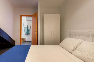 Cama o camas de una habitación en Lets Holidays COZY HOUSE in the CENTER of TOWN