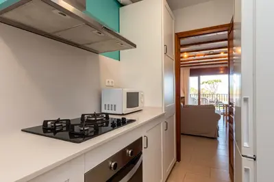 Una cocina o zona de cocina en E-2 CALELLA DE PALAFRUGELL 8 PAX